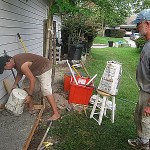 Mix concrete with electrical drill and pour slab